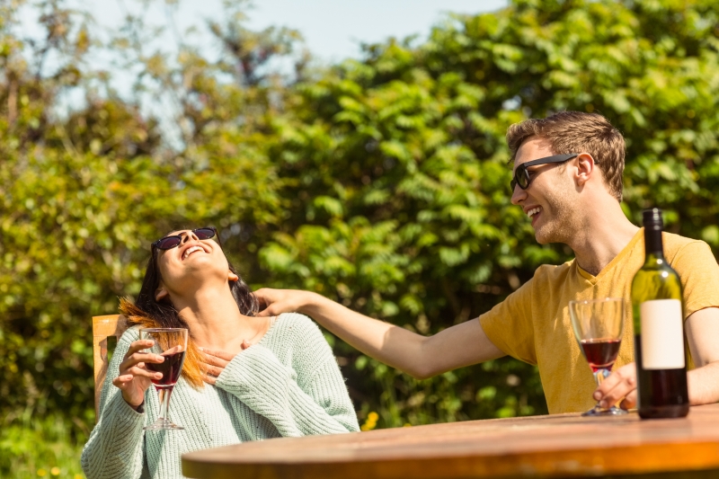 10211518-young-couple-enjoying-red-wine